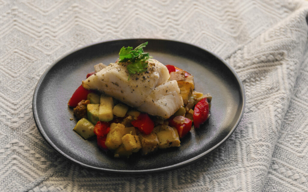 Fish steamed in mediterranean vegetables